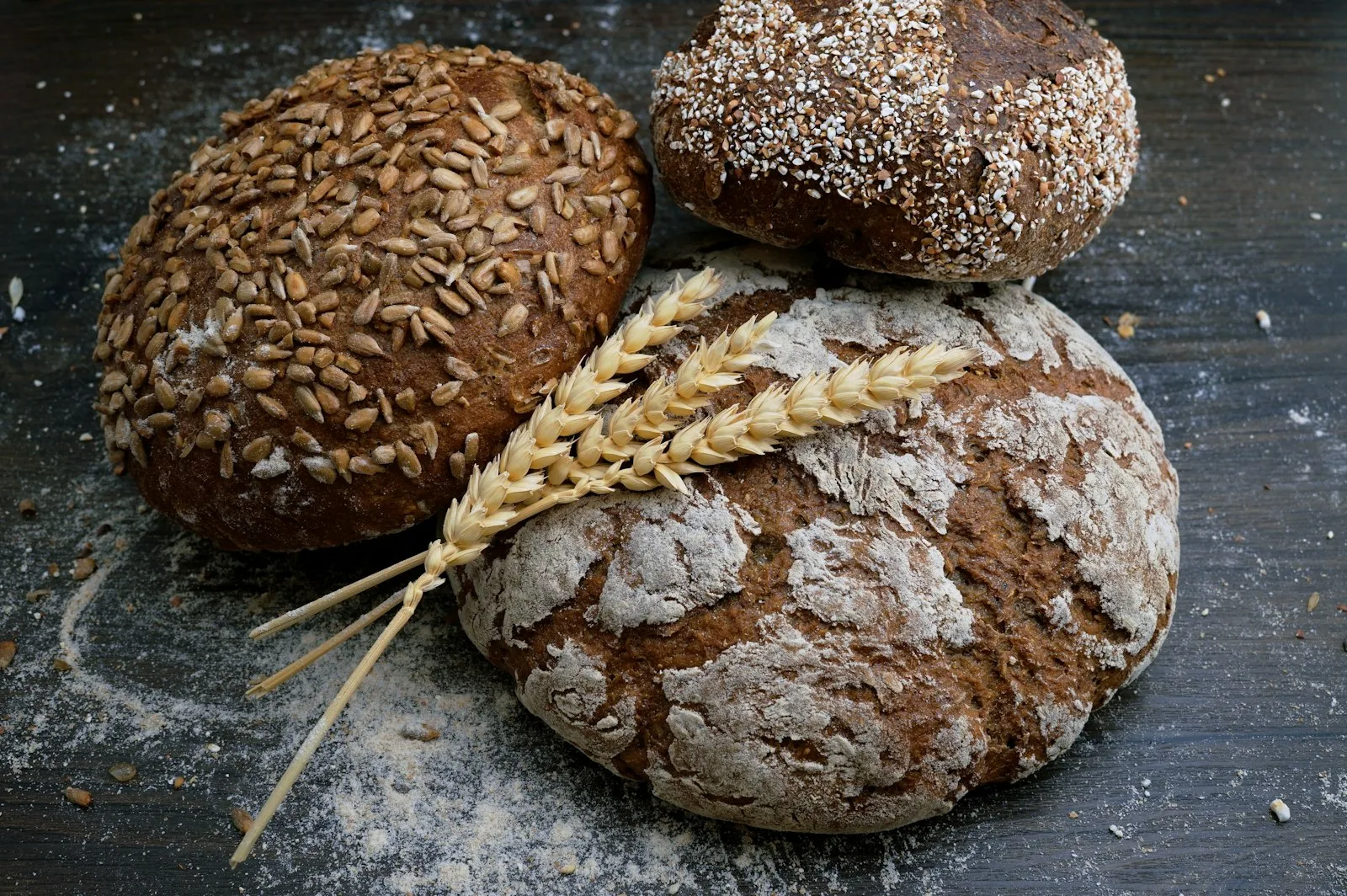 Freshly baked artisan sourdough loaves cooling on bakery racks in morning daylight